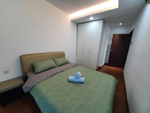 a bedroom with a bed with a blue toy on it at A.Foo Homestay 4.0 @ Vivacity Megamall Jazz Suite 4 in Kuching