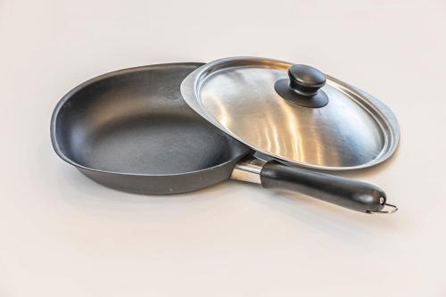a metal frying pan sitting on a white surface at アナザーオーシャン淡路ヴィラ in Awaji