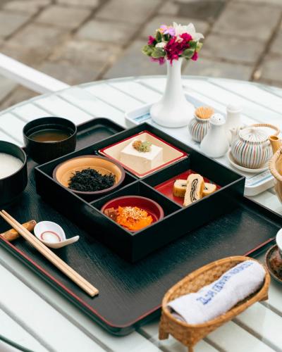 a tray of food on top of a table at Hokke Lumbini in Lumbini
