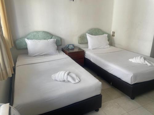 A bed or beds in a room at Residence Inn Pattaya