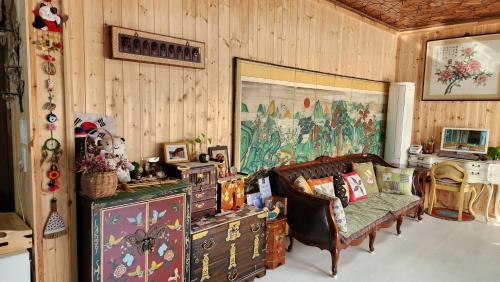 a living room with a couch and a chair and a table at 안동한옥 Shine Wolyeong in Andong