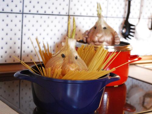 a blue pot filled with pasta in a kitchen at Haus Südblick in Zell am See