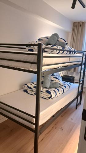 Postel nebo postele na pokoji v ubytování Trendy en modern appartement OSTENDIA