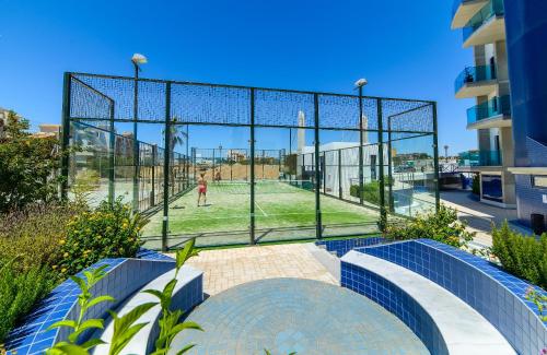 a batting cage with a person in a park at Apartamento en Sea Senses Freya in Torrevieja