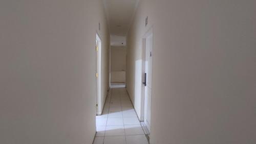 an empty hallway with at Superstar Residence Tomohon Redpartner in Tomohon