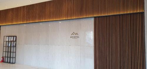 a wall in a building with a sign on it at AM Hotel in Pyeongchang 