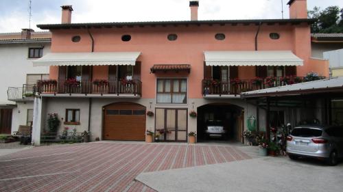 a building with a car parked in front of it at Al Castello in Artegna