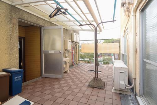 an outdoor patio with a building with an open door at Heights MR2 - Vacation STAY 88275 in Nara