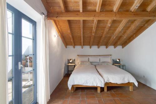 Ένα ή περισσότερα κρεβάτια σε δωμάτιο στο Casa Sintra