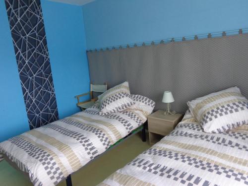 Postel nebo postele na pokoji v ubytování Les 3 nichoirs