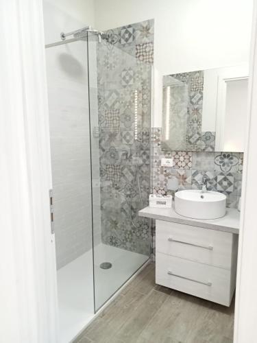 a bathroom with a shower and a sink at La dimora del cavatore in Favignana