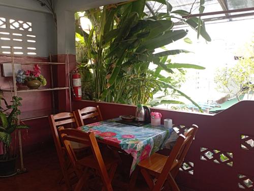 a table with chairs and a table cloth on it at Sabaydee House at Pai in Pai