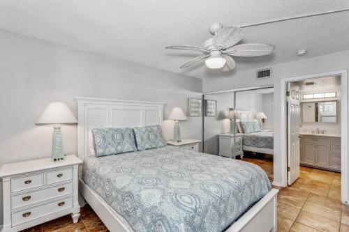a bedroom with a bed and a ceiling fan at Santa Rosa Dunes 923 in Pensacola Beach
