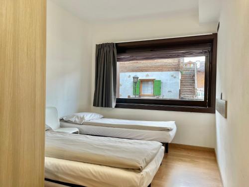 Letto o letti in una camera di Residence Adele