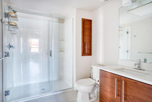 a bathroom with a shower and a toilet and a sink at Redwood City 2BR w Gym Parking nr Caltrain SFO-607 in Redwood City