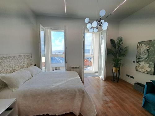 En eller flere senge i et værelse på Vigo bonito estudio en el centro