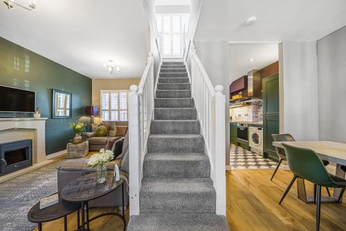 a staircase in a home with a living room and kitchen at Corner Lodge Bishophill York - FREE PARKING in York