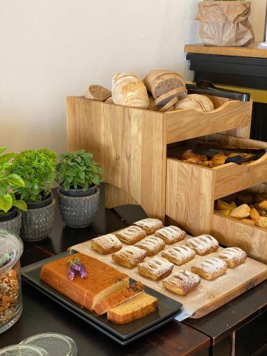 a table topped with lots of different types of bread at Kyparissia Beach Hotel in Kyparissia