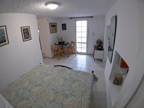 a view of a room with a table and a kitchen at Summer Dream in Poros