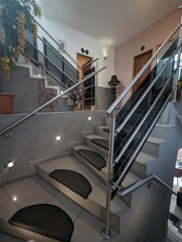 a staircase with metal railings and seats in a house at Hotel Eiserner Anton in Bielefeld