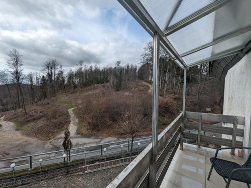 a screened in porch with a view of a giraffe at Hotel Eiserner Anton in Bielefeld