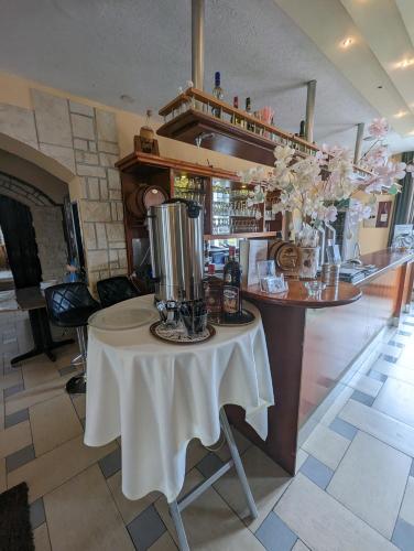a kitchen with a table with a blender on it at Hotel Eiserner Anton in Bielefeld