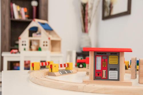 a toy house and a model house on a table at Boutique Hotel Kredo in Herceg-Novi