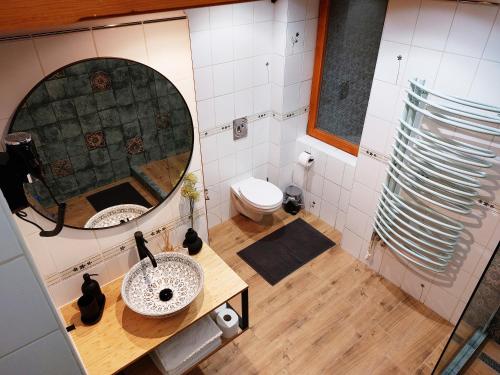 a bathroom with a sink and a mirror at SQUARE 16 - Absolutely Central Location in Szombathely