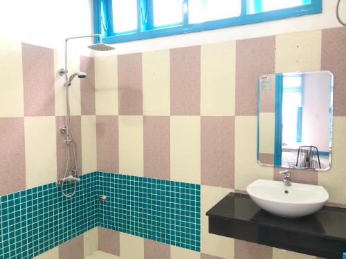 a bathroom with a sink and a mirror at An's Family Homestay Hoi An - 5mins walk to Hoi An Ancient Town in Hoi An