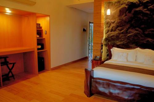 Postel nebo postele na pokoji v ubytování El Nido Bayview Resort