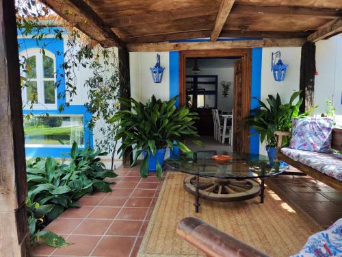 a living room with blue walls and a table at La Casita by Teresa in Marbella