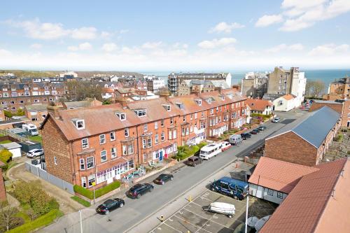an aerial view of a city with buildings and a street at White Rose Guest House in Filey