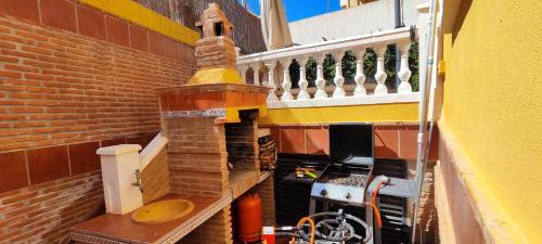a brick oven in the side of a building at Villa Granada Motril in Motril