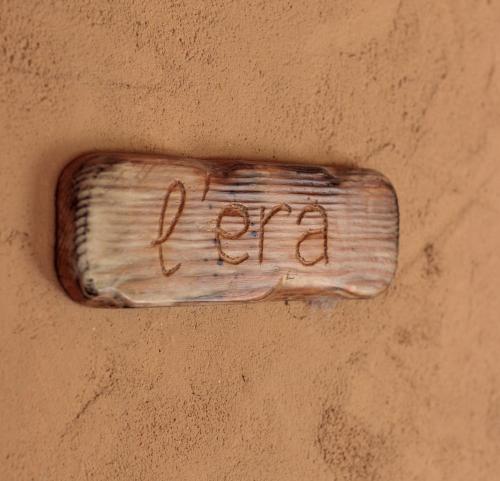 a bottle on the side of a wall with the word fix at Mas Teixidor in Crespiá