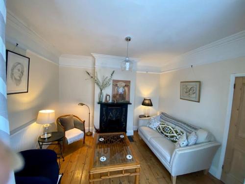 a living room with a couch and a coffee table at River walk . Shrewsbury.Shropshire.With parking. in Shrewsbury