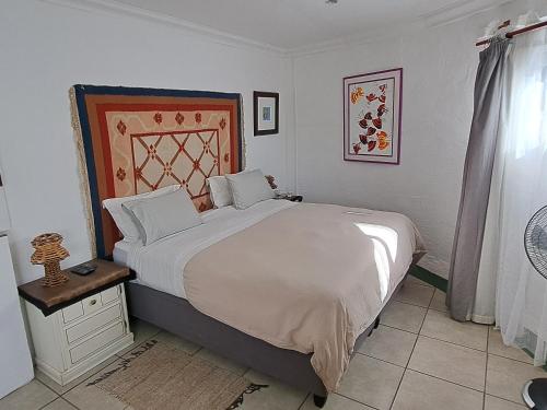 En eller flere senge i et værelse på Purple House B&B Smithfield