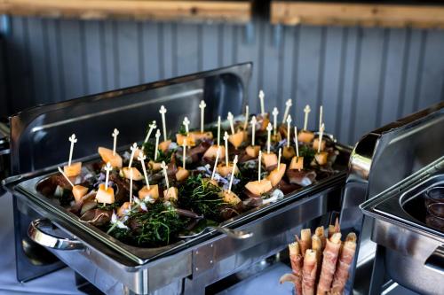 a row of trays of food in an oven at Hotel Viktor in Viktorsberg