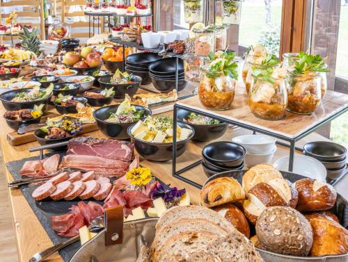 a buffet with many different types of food on a table at Wellnesshotel Sonnenhof & Sonnhalde in Ühlingen-Birkendorf