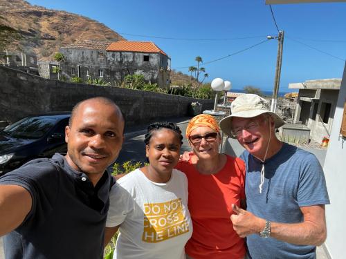 a group of people posing for a picture at Dunas De Areia Preta in Ribeira da Prata