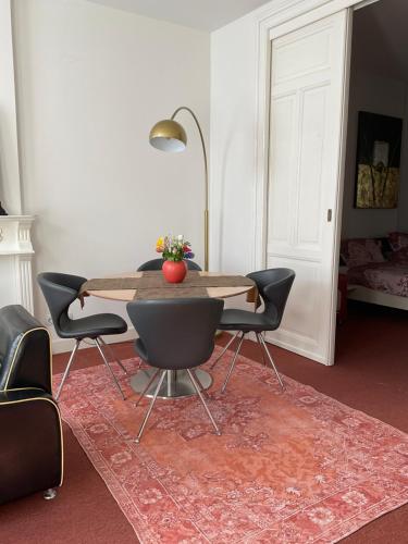 a dining room with a table and four chairs at inn Venlo Apartment in Venlo