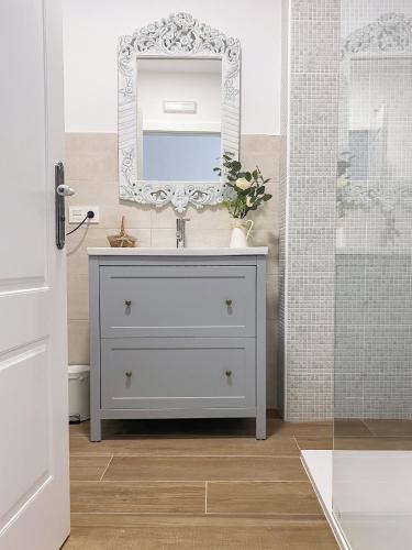 a bathroom with a sink and a mirror at Villaprado in Cambados