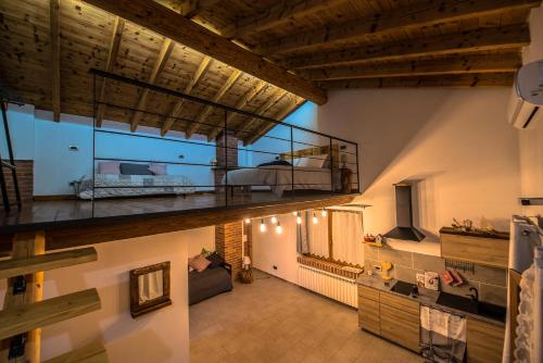a room with a balcony with a bed on it at Cascina Lunguria in Francavilla Bisio