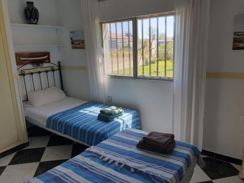 Кровать или кровати в номере Casa Francesca, 90 m2, jardin de 1500m2