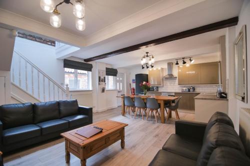 a living room with a couch and a table at Murton Grange in York