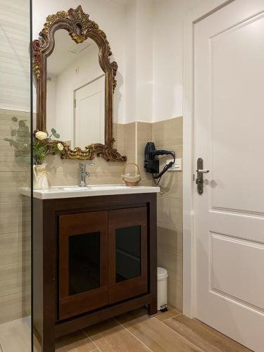 a bathroom with a sink and a mirror at Villaprado in Cambados