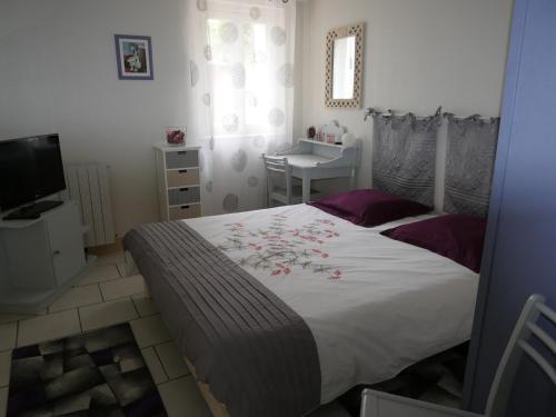 Posteľ alebo postele v izbe v ubytovaní Gite aux Minimes - Au jardin des alouettes