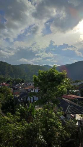 a view of a city with trees and buildings at Foggy Mount View in Bandarawela