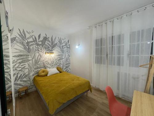 a bedroom with a bed with two teddy bears on it at Villa Sérénité in Noisy-le-Grand