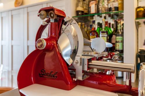 a red mixer sitting on top of a counter at Hotel Watthof in Rantum