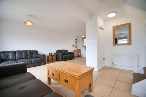 a living room with a couch and a coffee table at Murton Grange in York